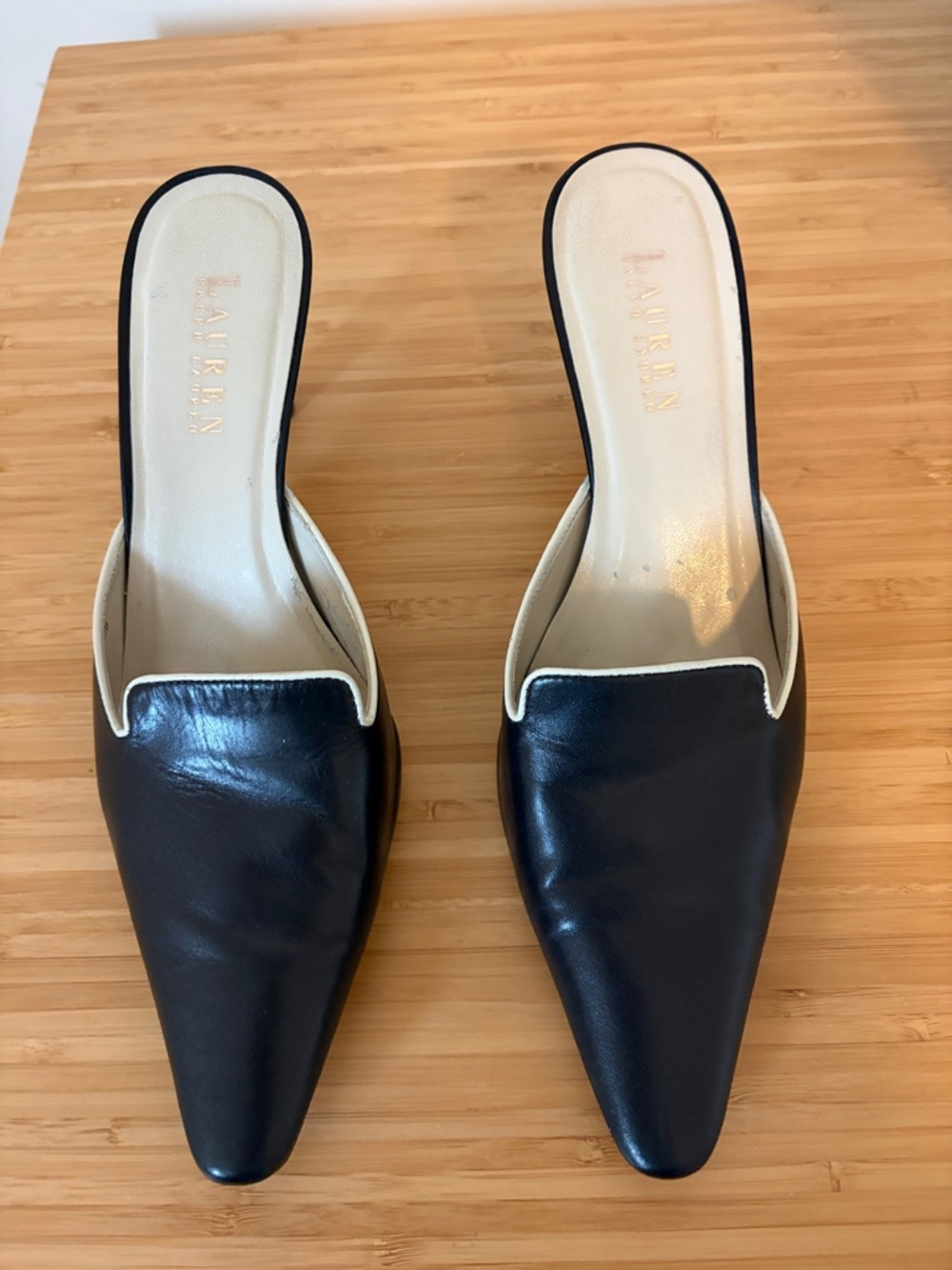 Ralf Lauren slides size 8.5 navy with white trim. Small area of peeling inside.